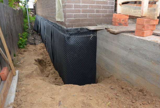 SJ Waterproofing Pros technician performing targeted Exterior Waterproofing assessment in Clarendon Hills, IL